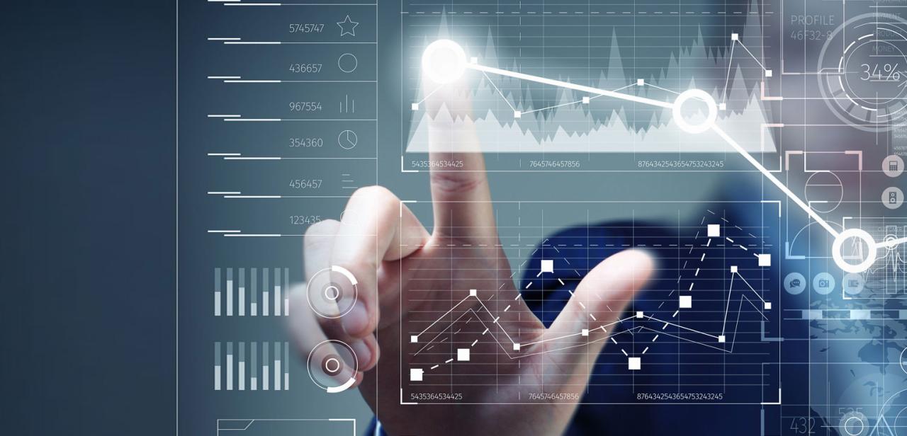 A conceptual image of real-time data interaction, with a hand activating a responsive digital display showing business trends and analytics.