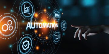 A visual metaphor for technological automation, displaying glowing icons and the word "AUTOMATION" being interacted with by a human hand.